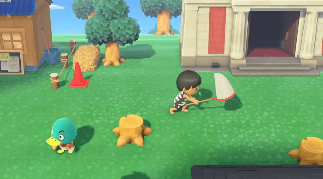 Player fishing by a river next to their house in Animal Crossing.