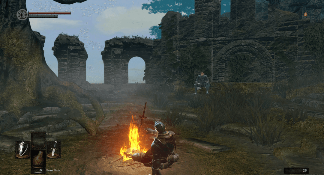 Gameplay screenshot showing the player character resting at a bonfire in Dark Souls.